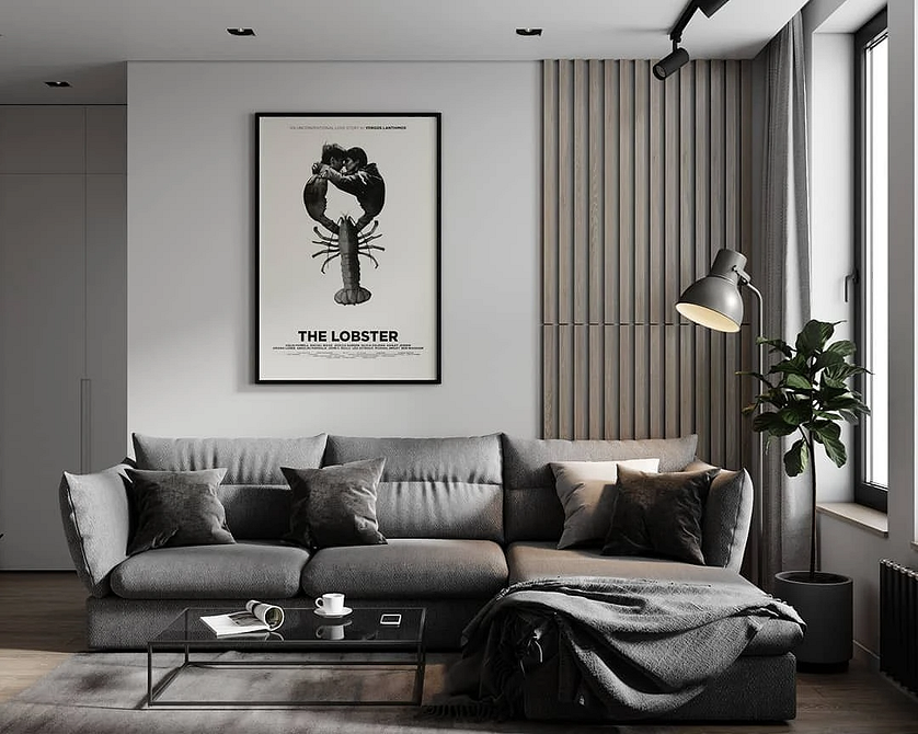 Сірий диван в інтер'єрі вітальні з декоративними подушками та текстилем для затишку