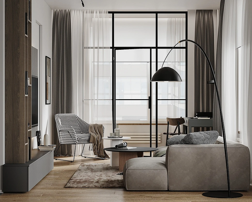 Інтер'єр з сірим кутовим диваном, картинами на стіні та декоративними подушками.