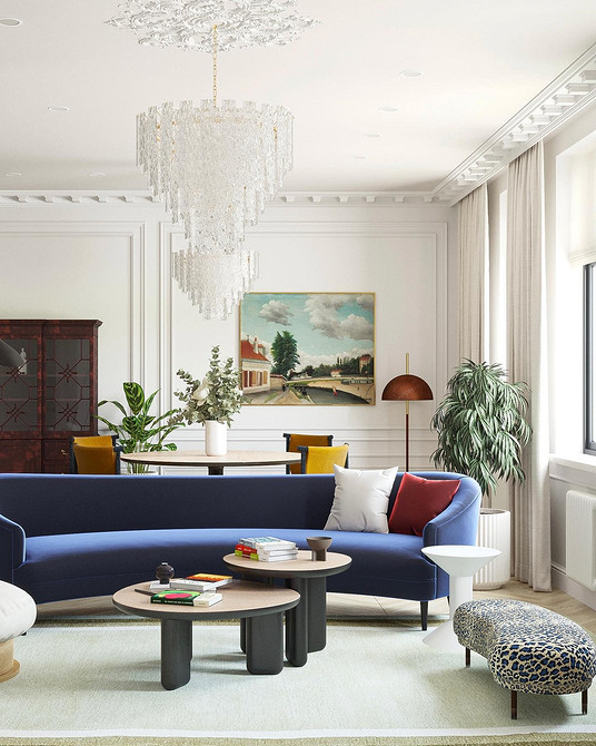 Інтер'єр з синім диваном та книжковою шафою, затишний куточок для читання