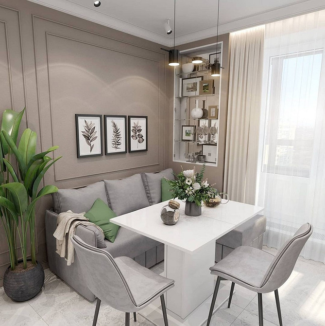 Інтер'єр кухні з кутовим диваном в світлих тонах для візуального розширення простору.