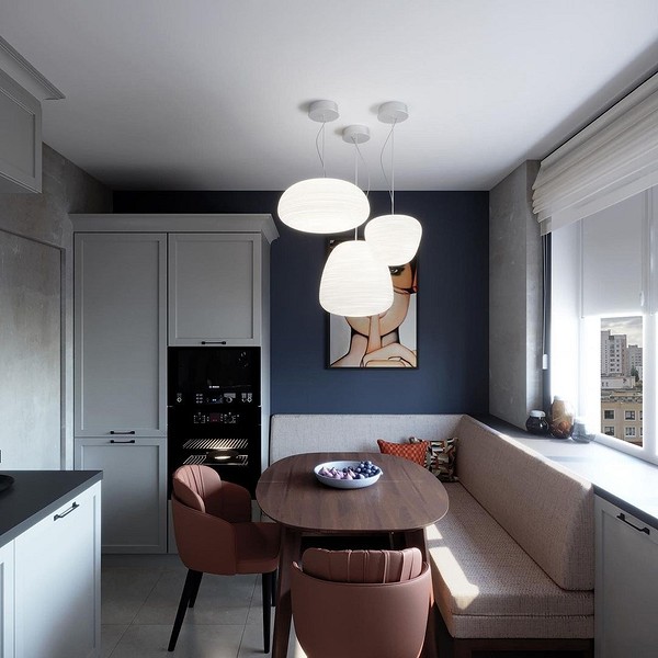 Затишний кутовий диван на кухні з м'якою оббивкою, ідеальний для відпочинку та економії простору.