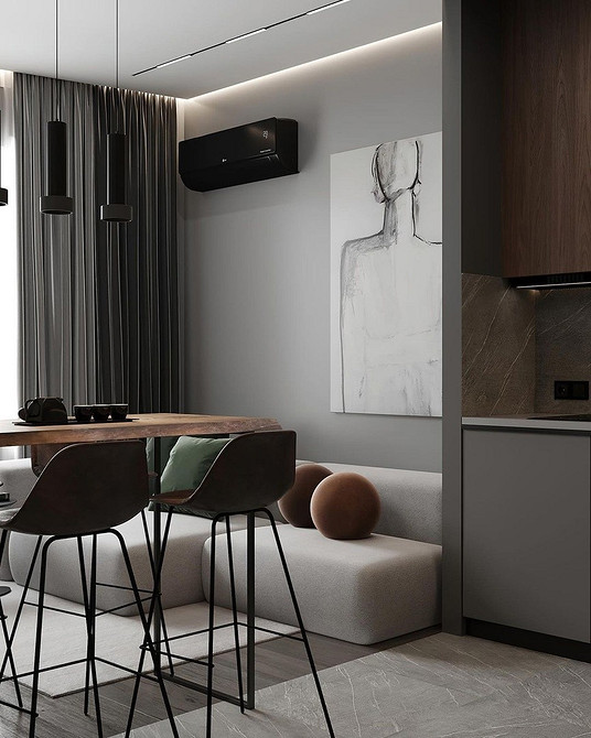 Стильний кутовий диван з темною оббивкою, сучасний дизайн кухні з яскравим акцентом.