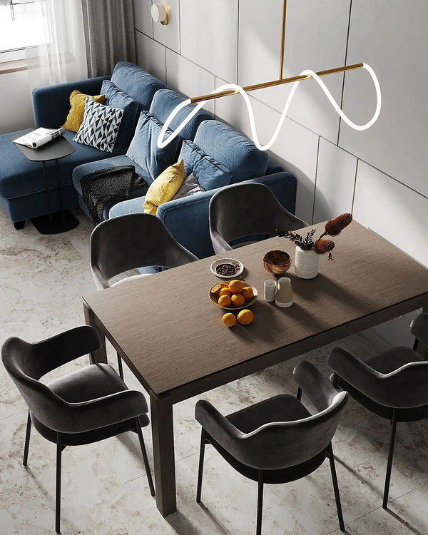 Розміщення кутового дивана у вітальні біля вікна для затишного інтер'єру