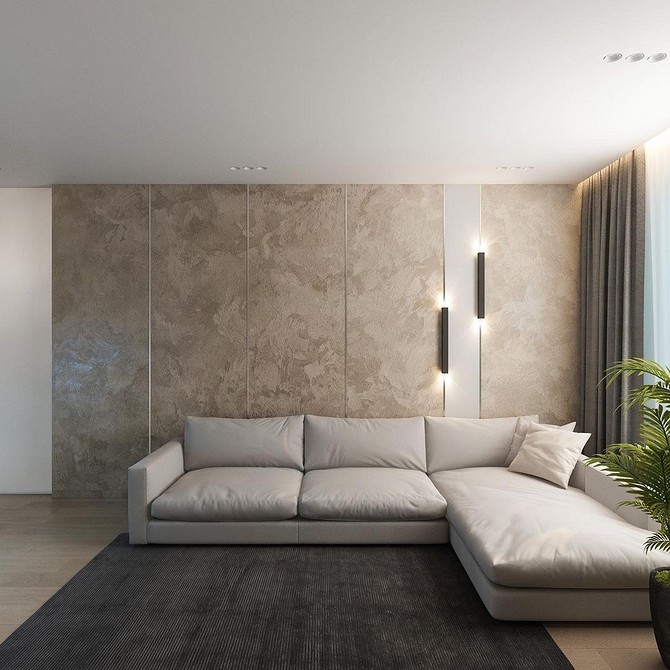 Кутовий диван у вітальні з сірою оббивкою та декоративними подушками