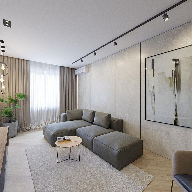 Кутовий диван з текстильною оббивкою в інтер'єрі сучасної вітальні