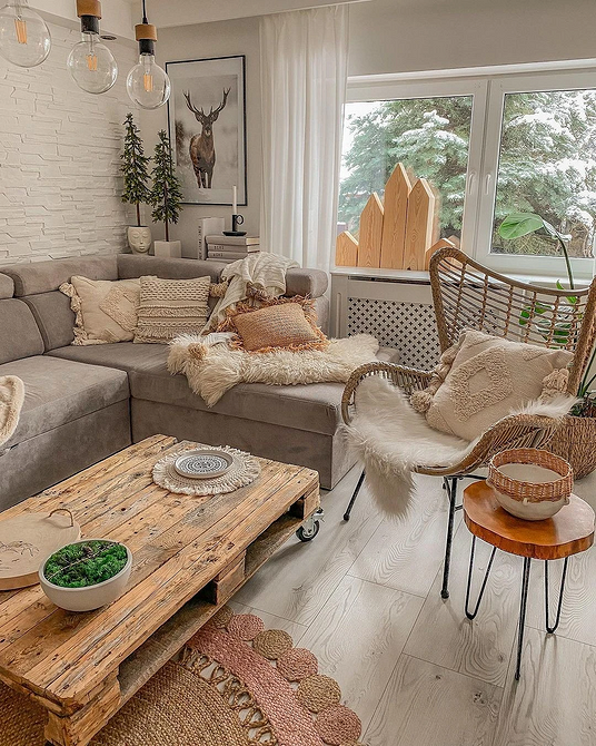 М'які меблі у вітальні: як правильно розмістити кутовий диван біля вікна