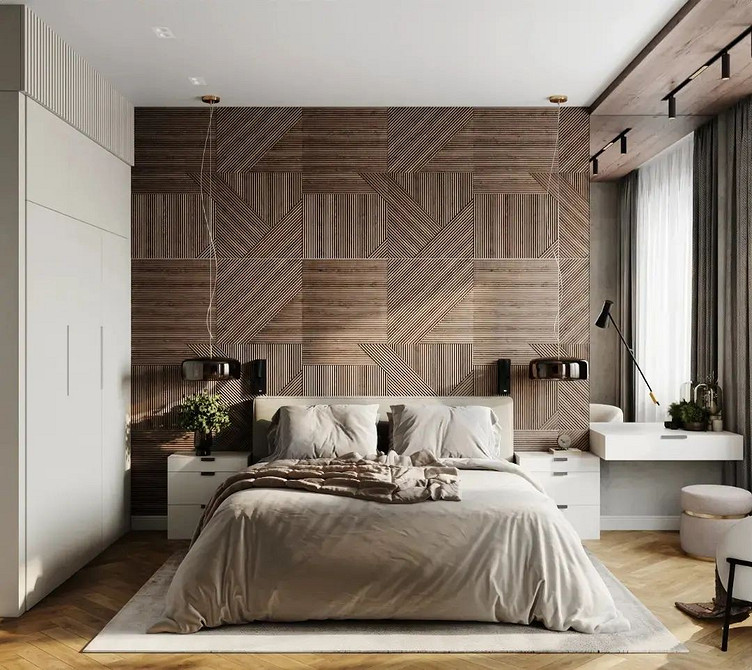 Простора спальня з великим ліжком-подіумом та зоною відпочинку біля вікна.