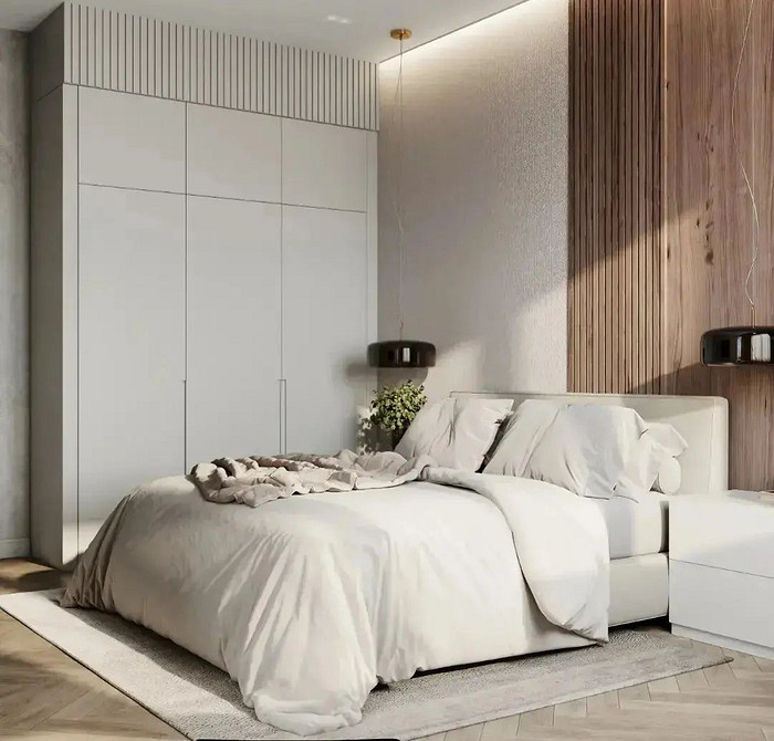 Стильне ліжко з великим шкіряним узголів'ям для розкішного дизайну спальні.