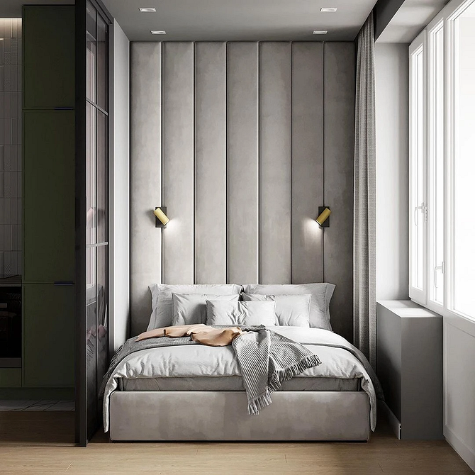 Дизайн спальні з ліжком-подіумом для зонування простору та зберігання речей.
