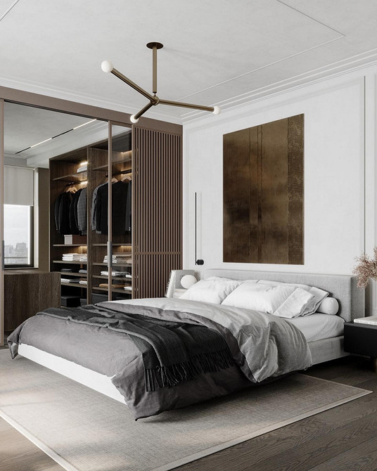 Мінімалістичний дизайн спальні з ліжком-подіумом та лаконічними формами меблів.