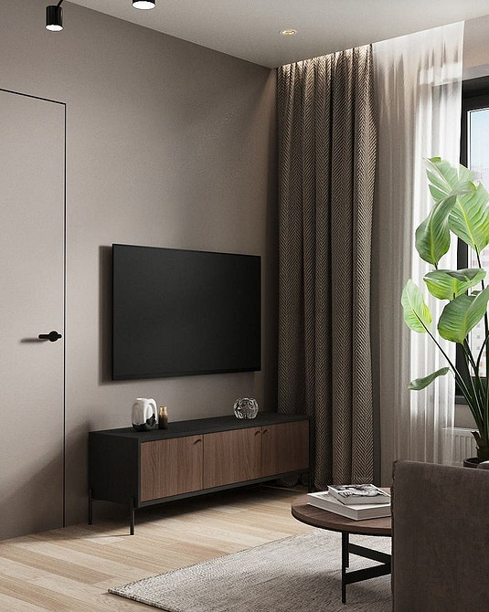 Тумба під телевізор з висувними шухлядами для зберігання речей у вітальні.