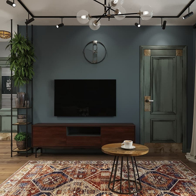 Біла тумба під телевізор з глянцевою поверхнею в сучасній вітальні.