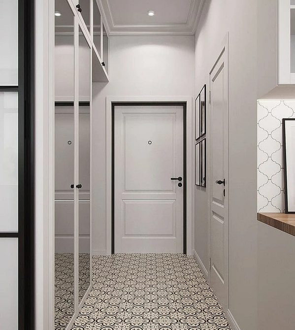 Сучасна шафа з великим дзеркалом та мінімалістичним дизайном інтер'єру