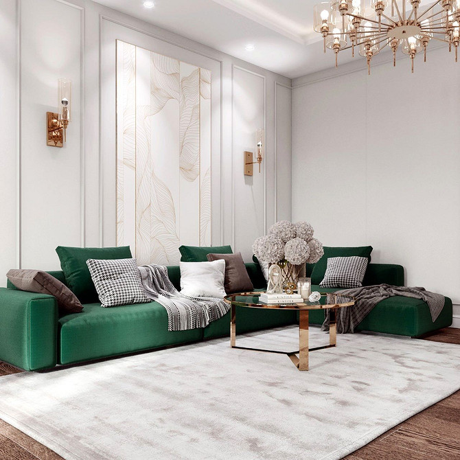 Стильний зелений диван з різними декоративними подушками і текстурами