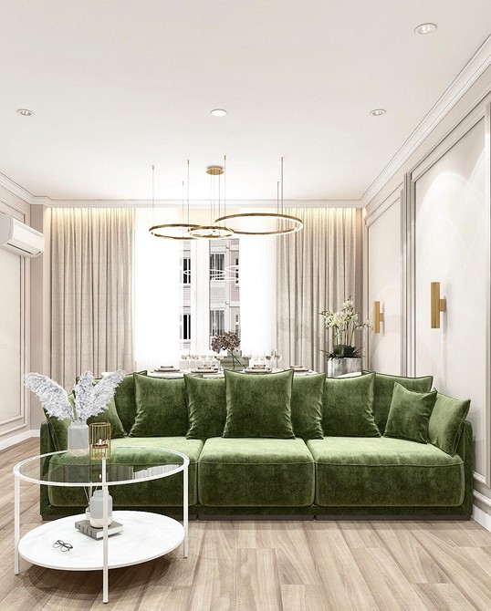 Темно-зелений диван в інтер'єрі з акцентною стіною та картинами