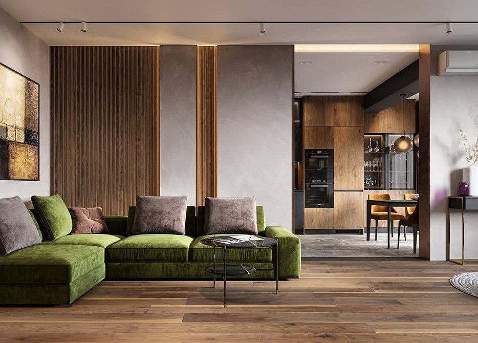 Зелений диван в інтер'єрі вітальні з дерев'яними елементами та килимом