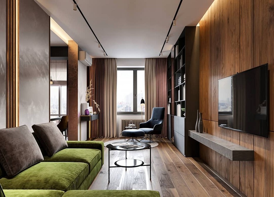 Сучасний зелений диван в мінімалістичній вітальні з білими стінами