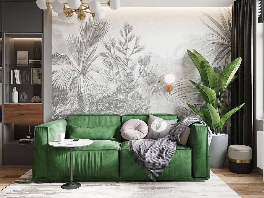 Дизайн вітальні з салатовим диваном, килимом та декоративними рослинами