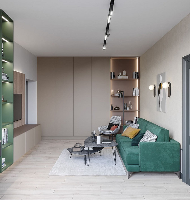 Зелений диван в інтер'єрі з дерев'яними елементами та декоративним текстилем