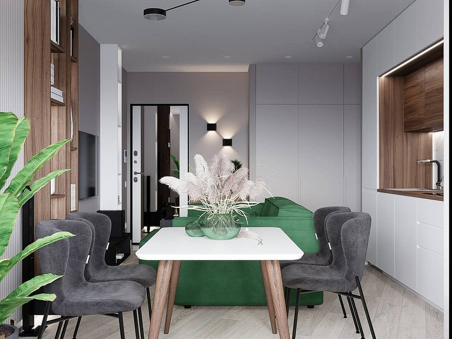 Інтер'єр з акцентом на зеленому дивані, декоративному текстилі та кольорах