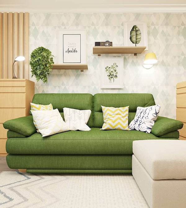 Зелений диван у вітальні з подушками: поєднання кольорів та матеріалів