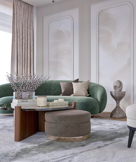 Вітальня з зеленим диваном, білими стінами та яскравими декоративними елементами