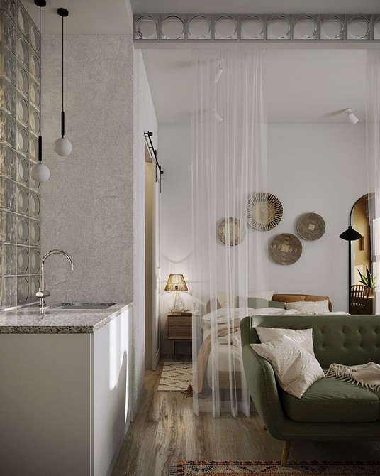 Інтер'єр вітальні з зеленим диваном: як правильно підібрати відтінок та аксесуари