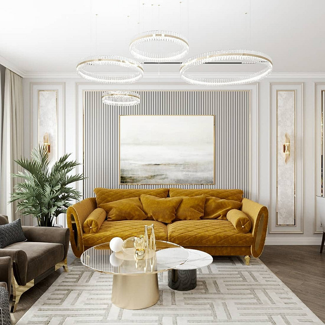 Елегантний жовтий диван у вітальні з килимом та декоративними подушками.