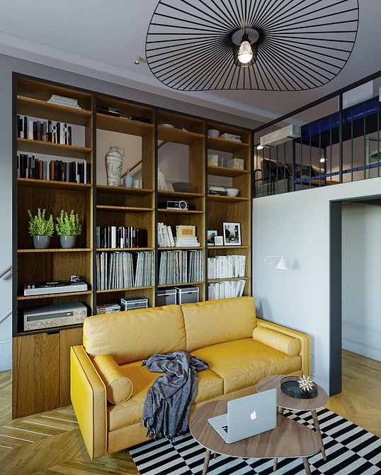 Невеликий жовтий диванчик в мінімалістичній вітальні з каміном та дерев'яною підлогою.