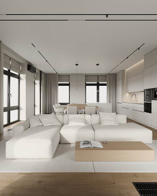 Затишна вітальня з м'яким диваном та декоративними подушками, тренди 2026.